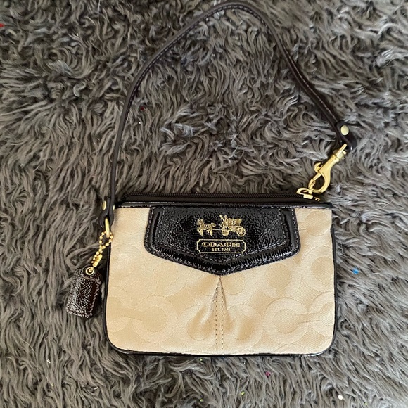 NWOT Coach wristlet with modern “C” on the traditional canvas gold material. - Picture 2 of 5